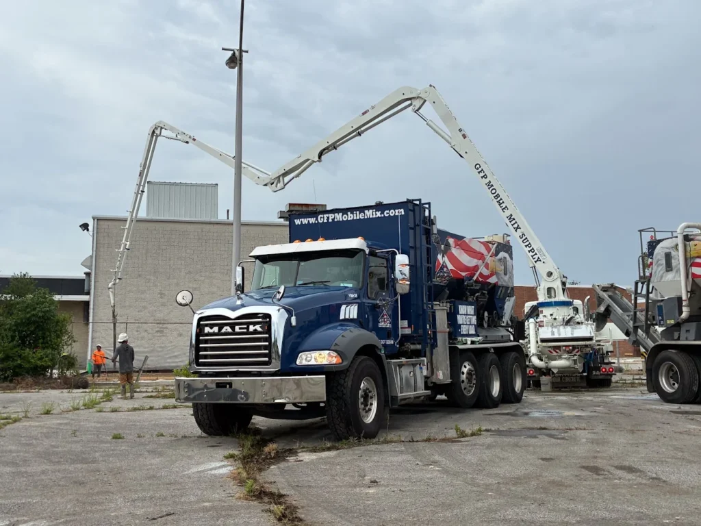 Concrete pump truck on job site.
