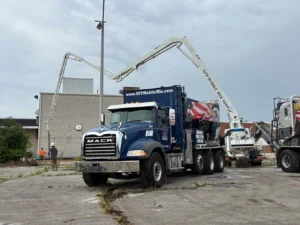 Concrete pump truck on job site.